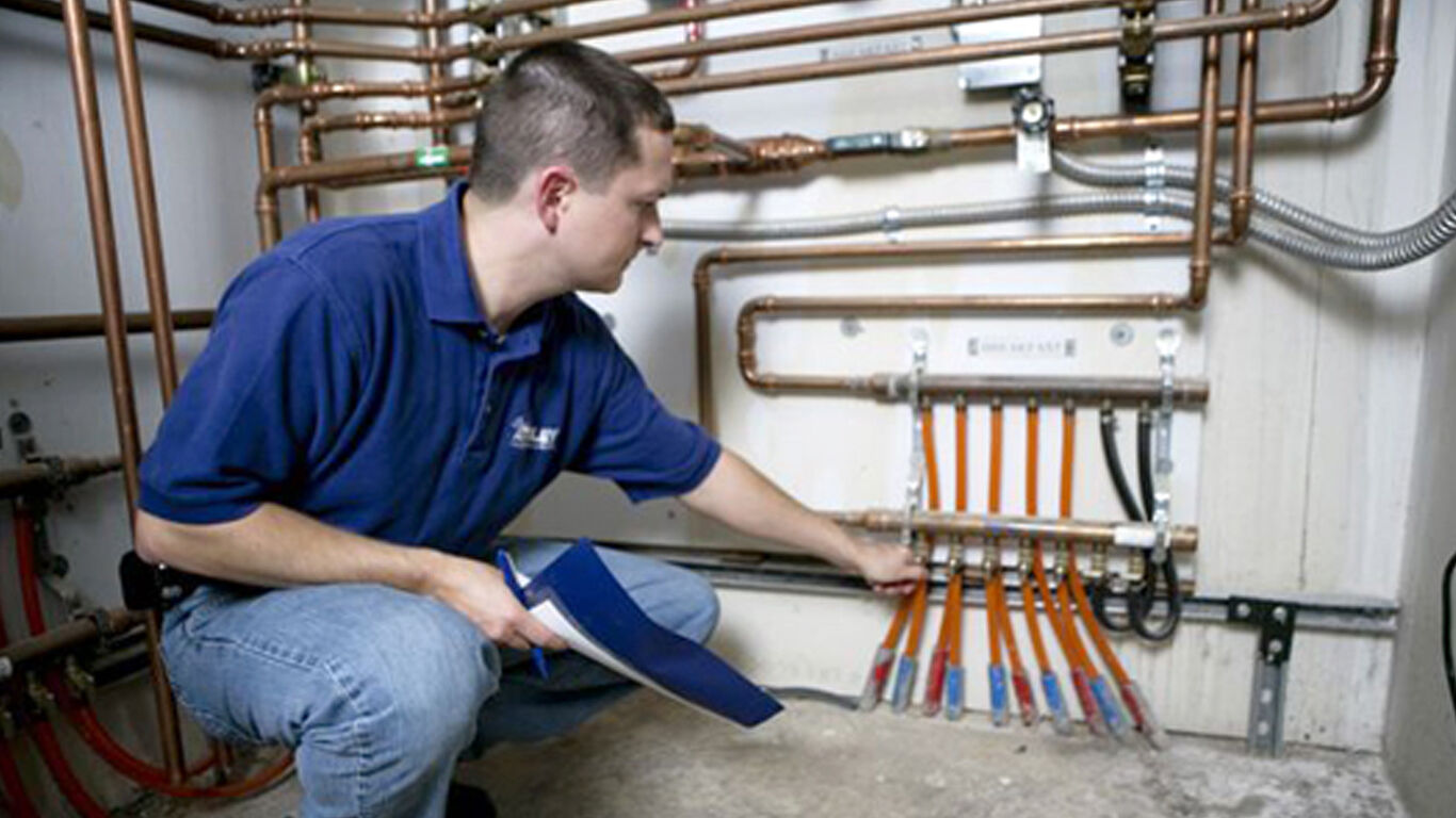 Man showing parts of the radiant heating system